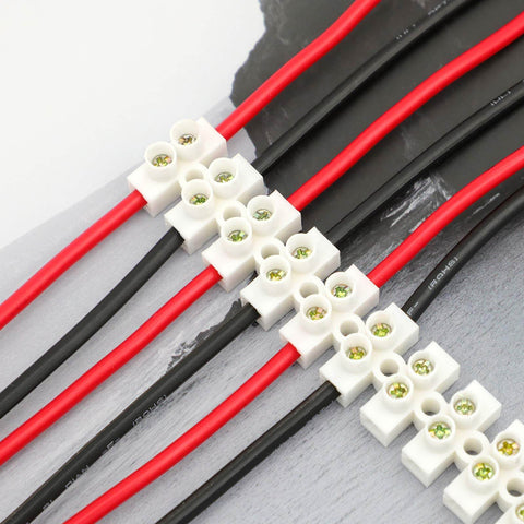 7 Piece 12 Position Dual Row Terminal Block Set for Electrical Wiring 10A 380V Barrier Strip Connector in use with red and black wires