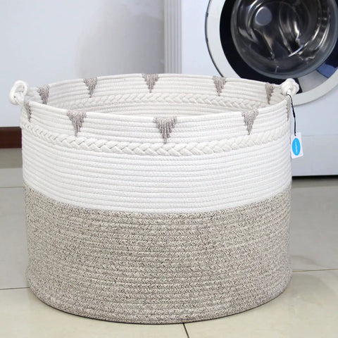 Huge Boho Blanket Basket 22 By 22 By 16 Inches Cotton Rope Storage Hamper For Throws Pillows Towels And Laundry Foldable Durable Decorative Round Organizer For Living Room Brown in front of a washing machine.