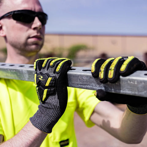Person wearing Unisex Cut Resistant Nitrile Glove With A6 Protection, TPR Straps, and TEKTYE Yarn, holding a metal bar.