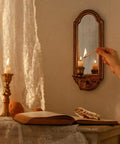 Vintage Gold Wall Mounted Candle Sconce With Mirrored Backplate And Floral 3D Woven Texture For Bathroom Or Living Room Certified Prime Real Estate Home Decor Accessory That Elevates Your Daily Vibes Always with a lit candle.