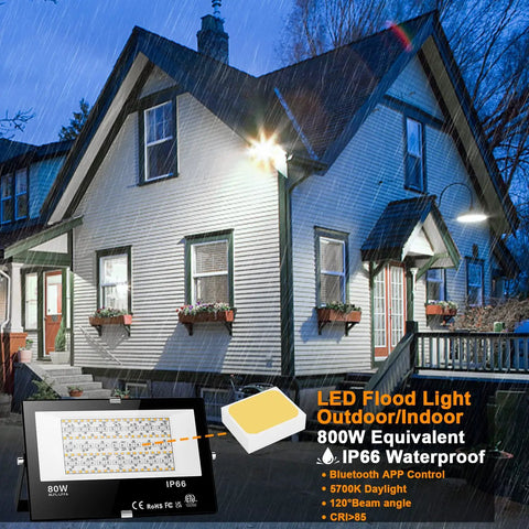 Outdoor Dope RGB Flood Light Kit With Bluetooth App Control illuminating a white house, 8000 Lumens, 800W Equivalent, IP66 Waterproof