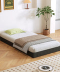 Heavy Duty Twin Bed Box Spring With Noise Free Metal Frame And Thick Fabric Cover For Memory Foam And Innerspring Mattresses Quick Snap Together Assembly Low Riser Sleep Game Changer on wooden floor with bedding and cushions.