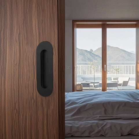 6 Inch Oval Black Pocket Door Pull Heavy Duty Stainless Steel Finger Flush Pull For Closet And Sliding Barn Doors 2 Pack Durable Rust Resistant 304 Stainless Hardware installed on wooden door in bedroom