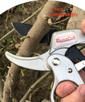 Ratcheting Pruning Shears 8 Inch Heavy Duty Garden Pruner With Anvil Cutter for thick branches, demonstrating cutting ability on branch