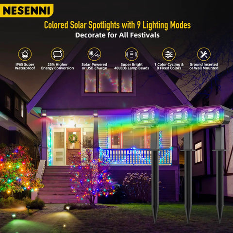 Color Changing Solar Outdoor Spotlights With 9 Lighting Modes And 40 LED Multicolor Lights illuminating a decorated house