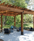 Outdoor pergola installed with 4x4 Post Base 8 Pack Beefy Heavy Duty Solid Steel Post Anchors With Black Powder Coat 13GA Thick for stability.