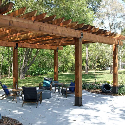 Outdoor pergola installed with 4x4 Post Base 8 Pack Beefy Heavy Duty Solid Steel Post Anchors With Black Powder Coat 13GA Thick for stability.