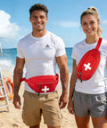 Two people on a beach wearing red Rugged First Aid Fanny Pack With MOLLE System Lifeguard Emergency Medical Waist Bag