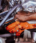 Mechanic using 8-In-1 SAE Ratcheting Wrench Set In Two Pieces With Hollow Sockets And Double Box End Design Includes 5/16 3/8 7/16 9/16 5/8 11/16 3/4 Inch 12 Point Ratchet Heat Treated For Durability Made In USA on engine