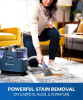 Person using Portable Carpet And Upholstery Spot Cleaner With SixFoot Hose For Deep Stain Busting on carpet in living room