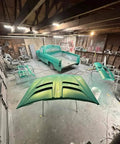 Rich Jade Green Basecoat Paint Gallon Drop In Ready To Spray With Included Fast Dry Reducer applied to truck parts in a workshop.