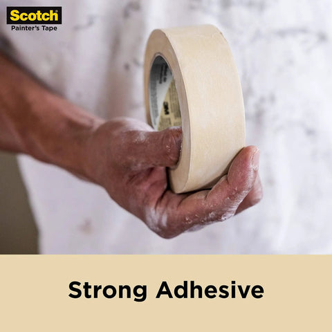 Person holding Go To Contractor Grade Tan Masking Tape For General Use And Multi Surface Projects, 1.41 Inch Wide By 60.1 Yards Per Roll.