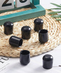 Seven Eighths Inch Folding Chair Leg Caps Set Heavy Duty Plastic Floor Protectors on woven mat
