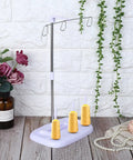 Top Tier 15 Bobbin Thread Stand For Sewing Machines, Rock Solid Embroidery Spool Holder With Slick Thread Flow, Effortless Operation Home Sewing Organizer, Purple showcasing three yellow spools.