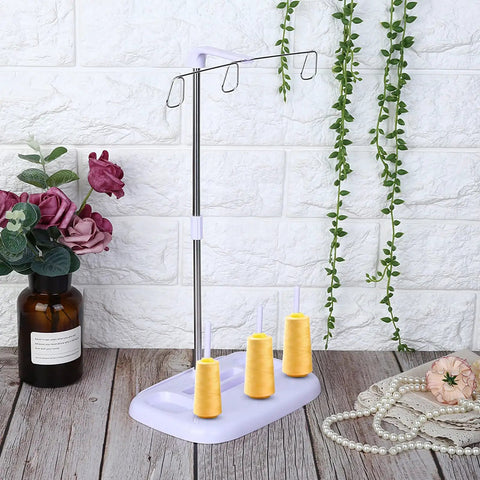 Top Tier 15 Bobbin Thread Stand For Sewing Machines, Rock Solid Embroidery Spool Holder With Slick Thread Flow, Effortless Operation Home Sewing Organizer, Purple showcasing three yellow spools.
