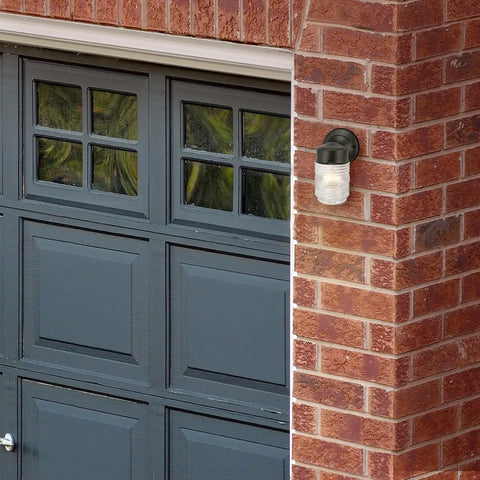 Level Up Your Porch With This Classic Jelly Jar Outdoor Wall Light In Sleek Matte Black on brick wall by garage.