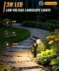 All In One LED Low Voltage Landscape Lighting Kit With 12 Aluminum 3W Lights illuminating garden pathway at night