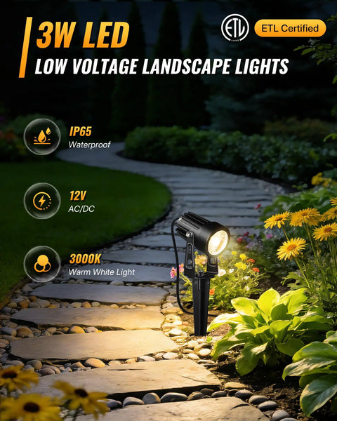 All In One LED Low Voltage Landscape Lighting Kit With 12 Aluminum 3W Lights illuminating garden pathway at night