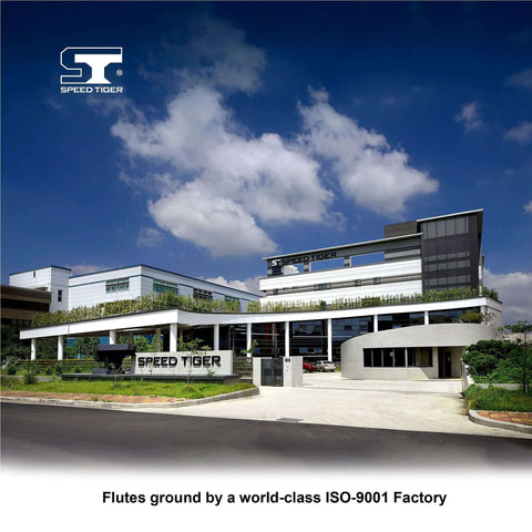 Speed Tiger logo on a modern factory exterior under a blue sky