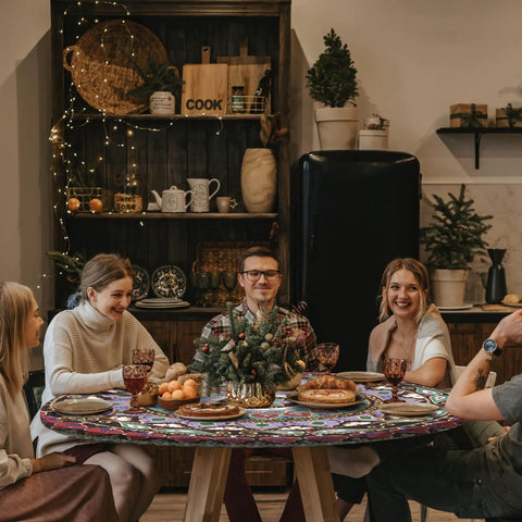 Group dining around a table with a fitted round tablecloth waterproof vinyl circle cover fits 36 to 44 inch tables indoor