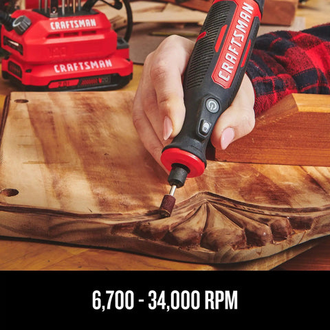 Person using Cordless Rotary Tool With Variable Speed Dial For Precise Finishing From 6,700 To 34,000 RPM on wooden surface