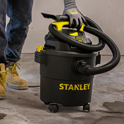 Powerful 5 Gallon Wet Dry Shop Vacuum With 4 Peak HP, 85 CFM, 3 In 1 Blower, shown on a garage floor with flexible hose.