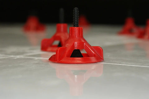 Close-up of Spin Doctor Tile Leveling System Caps 100 Piece Kit Reusable Caps Prevent Uneven Tiles With Large Format Floors Align And Level