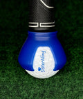 Close-up of 3-Prong Golf Ball Retriever Grabber with Back Saver Claw attached to putter grip, blue suction cup holding a golf ball.