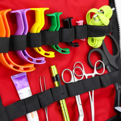 Large EMT Trauma Kit For First Responders, Fully Stocked Trauma Bag With Over 240 Supplies, airway tools and scissors visible in red bag