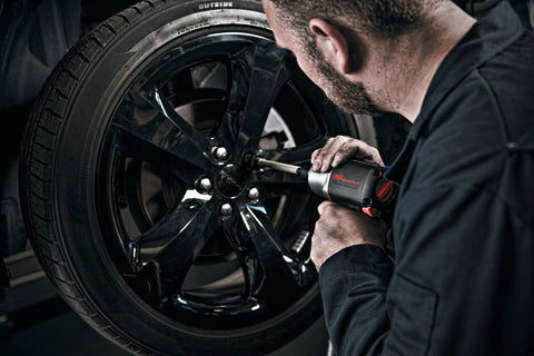 Heavy Duty Half Inch Drive Pneumatic Air Impact Wrench Delivers Over 1100 Ft Lbs Of Bone Crushing Torque used for tire changing.