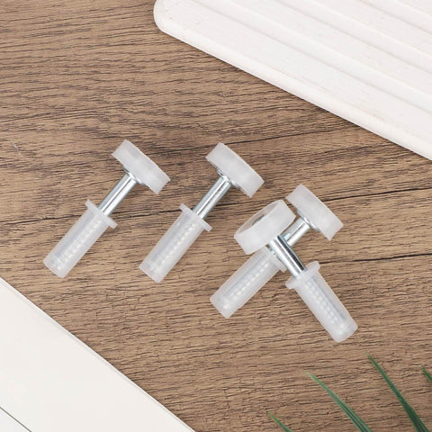 Four Pack Bi Fold Door Top Roller Guide Wheel And Pivot Kit With Seven Eighths Inch Spring Loaded Top Pivots on wood surface