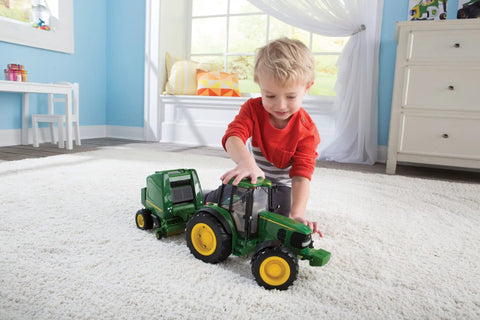Child playing with Big Farm Tractor And Baler Toy Set 1 16 Scale For Kids Ages 3 And Up With Realistic Lights And Sounds Durable Plastic