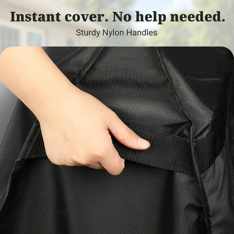 Hand holding Built To Last Heavy Duty Outdoor Prep Table Cover for Unity XL showing sturdy nylon handles.