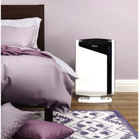 AeraMax 200 air purifier beside bed for use with Authentic Carbon Replacement Filters 4 Pack For AeraMax 200 Air Purifier Odor And VOC Removal Plus Capture Of Large Particulates Easy To Install Replacement Filter Set For Fresh Cleaner Indoor Air.