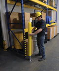 Hecka Sturdy Low Density Polyethylene Bollard Post Cover Slides On With Zero Sweat shields a concrete post in a warehouse.