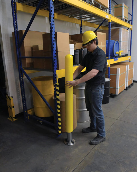 Hecka Sturdy Low Density Polyethylene Bollard Post Cover Slides On With Zero Sweat shields a concrete post in a warehouse.