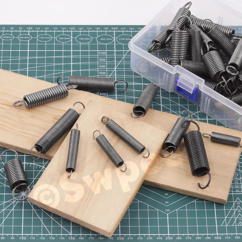 Solid Carbon Steel Spring Assortment Kit With 250 Piece Count Featuring 5 Versatile Compression Sizes For Heavy Duty Repairs And DIY Projects To Keep Your Gear Running Smooth And Tough Out There., carbon steel springs in plastic box on work mat