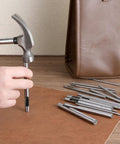 Using Leather Hole Punch Kit 0.5-7mm 17-Piece Round Hollow Punch Set for crafting with leather.
