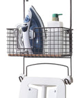 Metal Over The Door Or Wall Mount Ironing Board Holder With Large Storage Basket holding iron and detergent, 12x7x5.5in