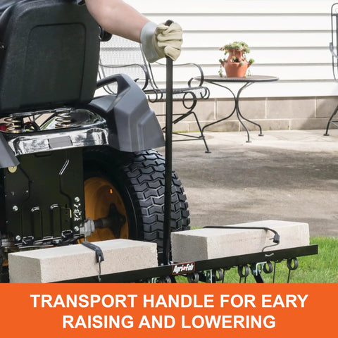Tow Behind Lawn Dethatcher 48 Inch Wide With 24 Durable Spring Steel Tines attached to lawn tractor, transport handle visible