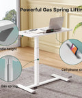 Mobile Standing Desk With Pneumatic Height Adjustment, Rolling Laptop Desk showing gas spring and cell phone slot, white
