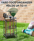 Garden Tool Organizer With 35 Slots And 6 Movable Hooks Heavy Duty Metal Tool Tower Rack in yard holding tools