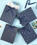 Four Pack 9 Inch Gift Bags In Premium Blue With Tissue Paper Medium Size 7x4x9 Inches Great For Birthdays Baby Showers Weddings Party Favors