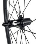 Close-up of 700C Road Bike Carbon Wheelset with 40mm UD X Weave Aero Rims and Rim Brake Surface hub details