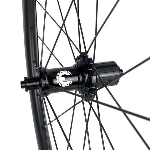 Close-up of 700C Road Bike Carbon Wheelset with 40mm UD X Weave Aero Rims and Rim Brake Surface hub details