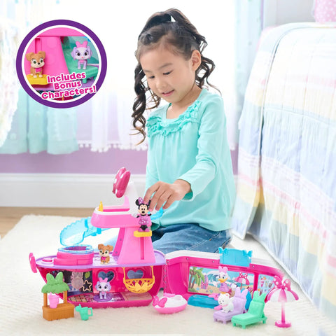 Child playing with Minnie Mouse Bowdazzling Yacht Lights And Sounds Playset With 16 Piece Figures And Accessories Pink Boat