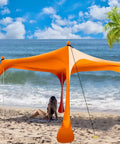 Grab And Go Pop Up Beach Tent 10 By 10 Ft Shade Sun Shelter UPF 50 Plus windproof waterproof canopy set up on a sunny beach