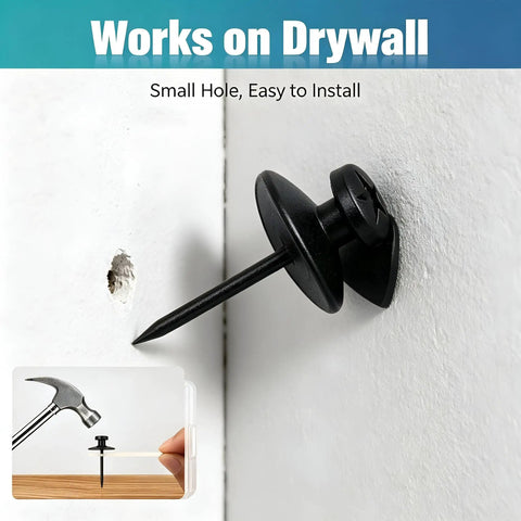 Sleek Double Headed Picture Hanging Nails For Drywall Renter Friendly Push Pins With Hand Protector Set Of 50 All Black Thumb Tacks embedded in drywall.