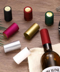 Premium Black Heat Shrink Bottle Caps For Wine And Spirit Sealing With No Sweat Party Wraps For Oil Jars And Crafts Heavy Duty Plastic Sealer Bulk Pack Of Two Dozen Units That Lock Tight For Home Use, displayed with various colors.