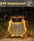 Owl-shaped solar lantern in rain, showcasing IP44 waterproof feature, part of Two Pack Hanging Solar Lanterns With Owl Pattern.